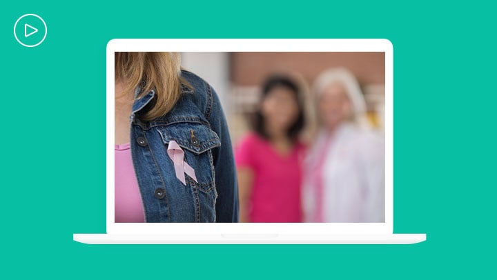 Thumbnail of a woman in a jean jacket wearing a pink ribbon with two related females in the background